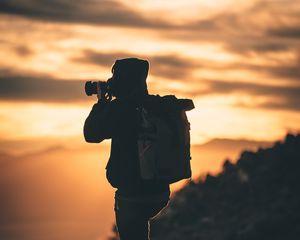 Preview wallpaper man, photographer, camera, silhouette, sunset