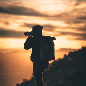 Preview wallpaper man, photographer, camera, silhouette, sunset