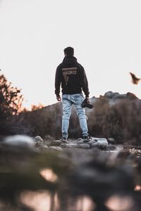 Preview wallpaper man, photographer, mountains, stones, nature