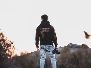 Preview wallpaper man, photographer, mountains, stones, nature