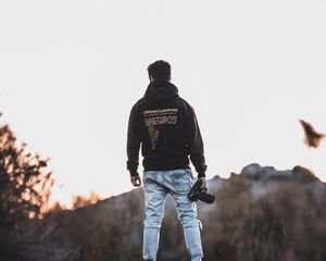 Preview wallpaper man, photographer, mountains, stones, nature