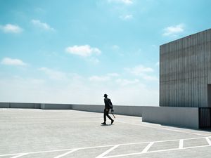 Preview wallpaper man, photographer, roof, building