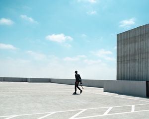 Preview wallpaper man, photographer, roof, building