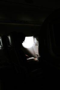 Preview wallpaper man, porthole, airplane, dark, rays