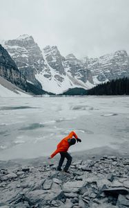 Preview wallpaper man, pose, mountains, snow, snowy