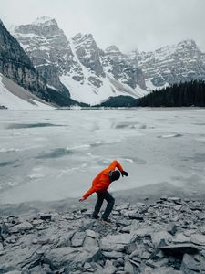 Preview wallpaper man, pose, mountains, snow, snowy