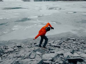 Preview wallpaper man, pose, mountains, snow, snowy