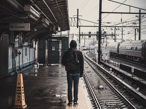 Preview wallpaper man, railway, station, platform, rails