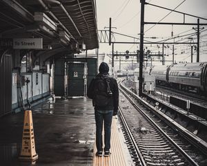 Preview wallpaper man, railway, station, platform, rails