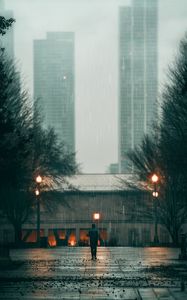 Preview wallpaper man, rain, loneliness, sad, walk, street, city