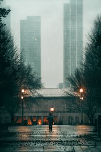 Preview wallpaper man, rain, loneliness, sad, walk, street, city