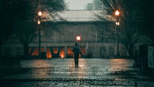 Preview wallpaper man, rain, loneliness, sad, walk, street, city