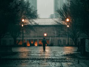 Preview wallpaper man, rain, loneliness, sad, walk, street, city