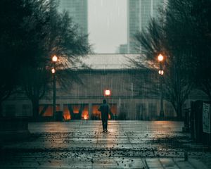 Preview wallpaper man, rain, loneliness, sad, walk, street, city