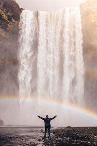 Preview wallpaper man, rainbow, waterfall, freedom