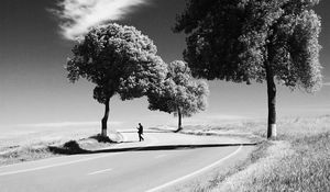 Preview wallpaper man, road, bw, loneliness, trees