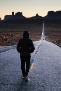 Preview wallpaper man, road, lonely, hood