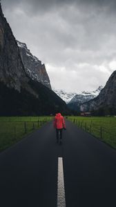 Preview wallpaper man, road, mountains, clouds