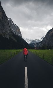 Preview wallpaper man, road, mountains, clouds