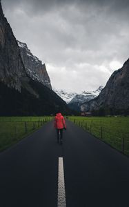 Preview wallpaper man, road, mountains, clouds