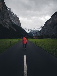 Preview wallpaper man, road, mountains, clouds