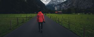 Preview wallpaper man, road, mountains, clouds