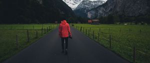 Preview wallpaper man, road, mountains, clouds