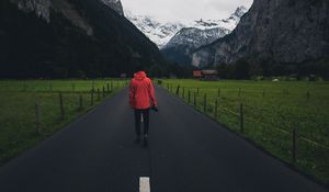 Preview wallpaper man, road, mountains, clouds
