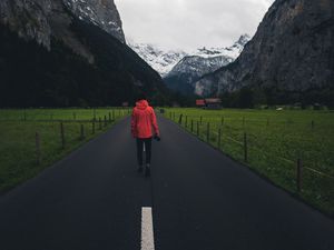 Preview wallpaper man, road, mountains, clouds