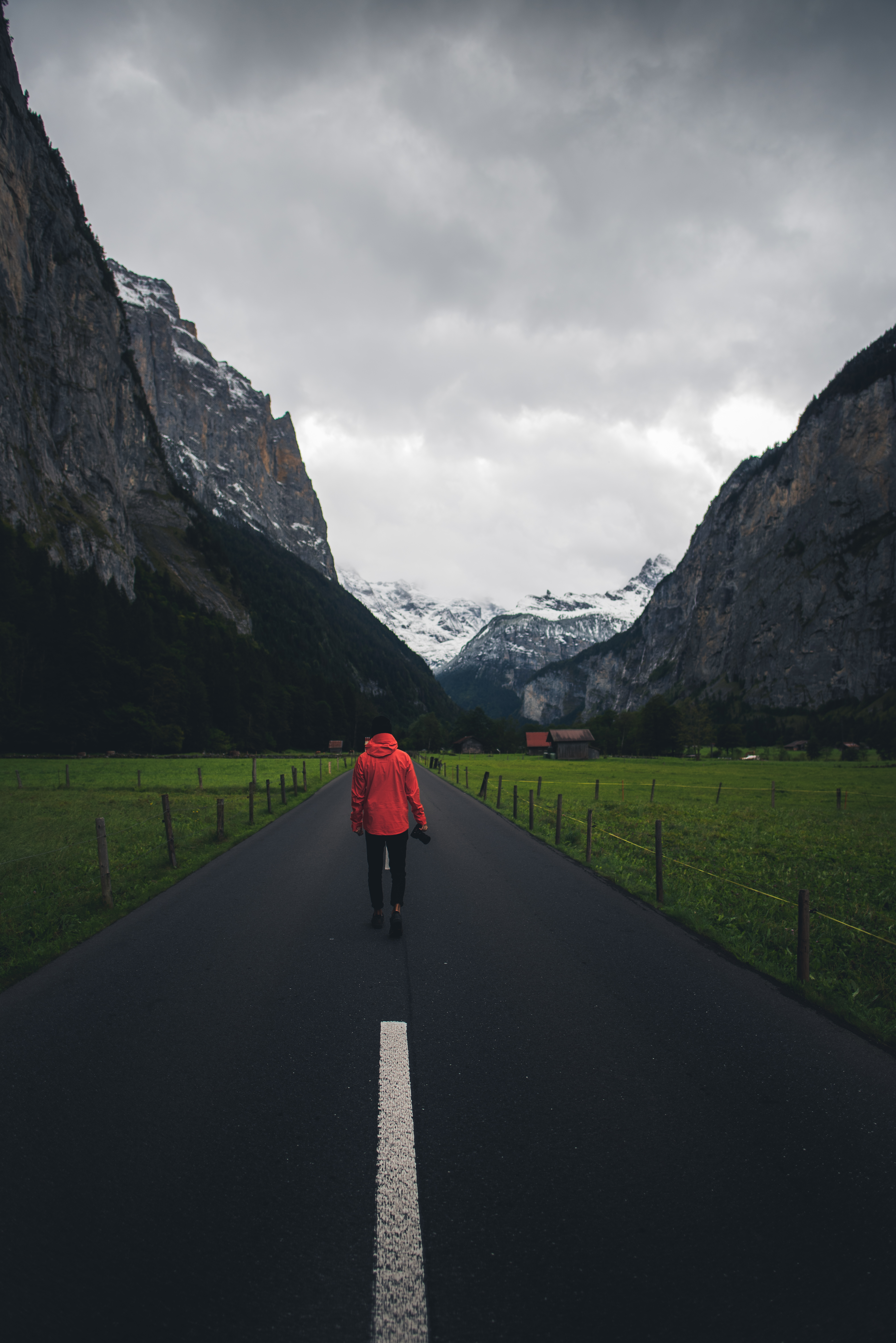 4016x6016 Wallpaper man, road, mountains, clouds