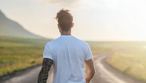 Preview wallpaper man, road, sunlight, walk, nature