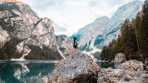 Preview wallpaper man, rock, mountains, lake, nature