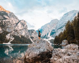 Preview wallpaper man, rock, mountains, lake, nature