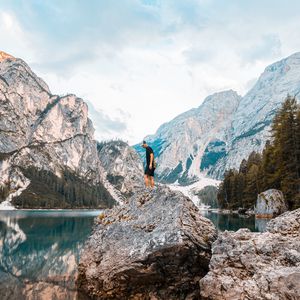 Preview wallpaper man, rock, mountains, lake, nature