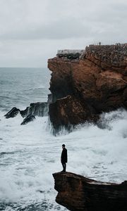 Preview wallpaper man, rock, sea, waves, alone