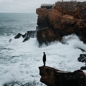 Preview wallpaper man, rock, sea, waves, alone