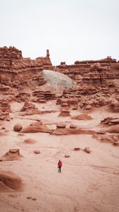 Preview wallpaper man, rocks, desert, alone, aerial view