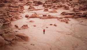 Preview wallpaper man, rocks, desert, alone, aerial view