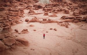 Preview wallpaper man, rocks, desert, alone, aerial view