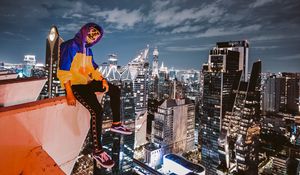 Preview wallpaper man, roof, buildings, city, overview