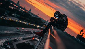 Preview wallpaper man, roof, mask, review, height, photographer