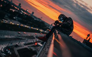Preview wallpaper man, roof, mask, review, height, photographer