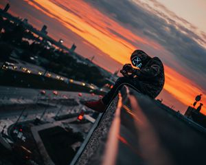 Preview wallpaper man, roof, mask, review, height, photographer