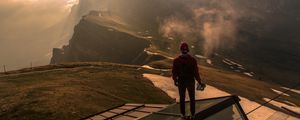 Preview wallpaper man, roof, mountains, height, clouds, fog, sunlight