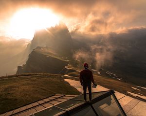 Preview wallpaper man, roof, mountains, height, clouds, fog, sunlight