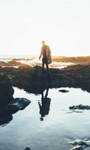 Preview wallpaper man, sea, coast, sunlight, waves
