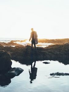 Preview wallpaper man, sea, coast, sunlight, waves