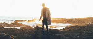 Preview wallpaper man, sea, coast, sunlight, waves
