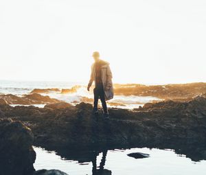 Preview wallpaper man, sea, coast, sunlight, waves