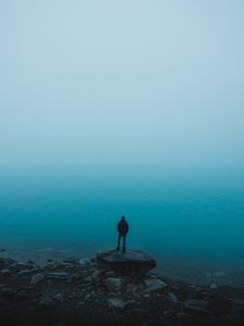 Preview wallpaper man, sea, stones, loneliness, alone